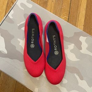 Ruby red Rothy’s round toe flats